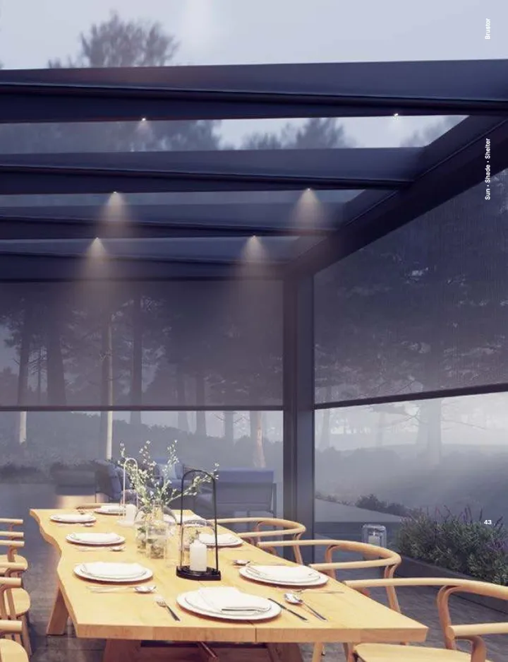 Pergola Brustor à toit en verre éclairée le soir